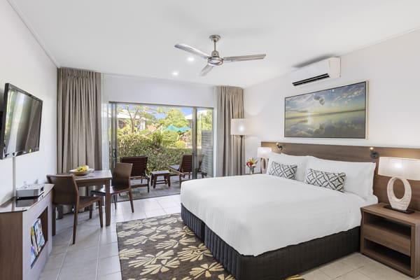 air conditioned bedroom with comfortable double bed, modern furniture, Foxtel and Wi-Fi in hotel Studio apartment at Oaks Cable Beach Sanctuary holiday accommodation in Broome, Western Australia