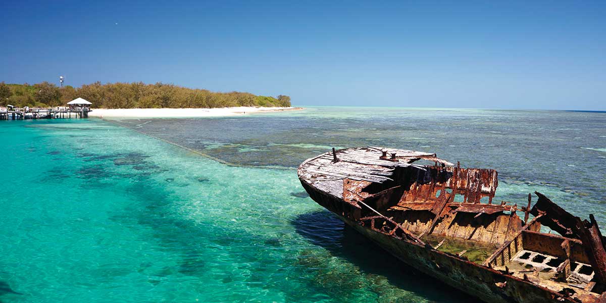 Heron Island, a breathtaking island within the Great Barrier Reef with white sand and clear turquoise waters