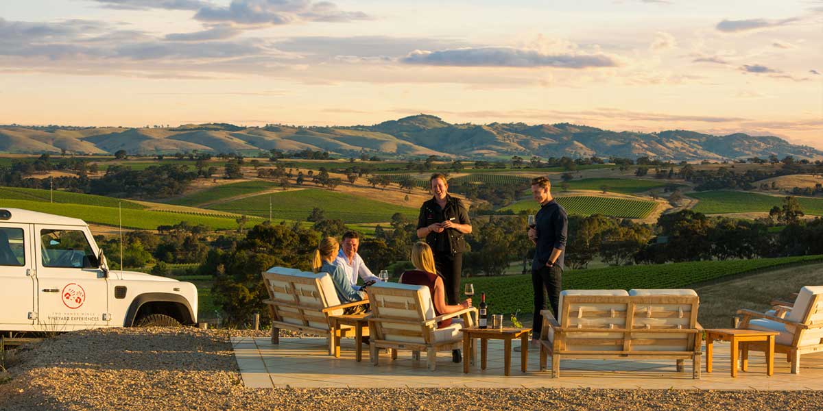 Wine lovers enjoying their time together while tasting some wines from the Chateau Tanunda Estate and enjoying sunset outside