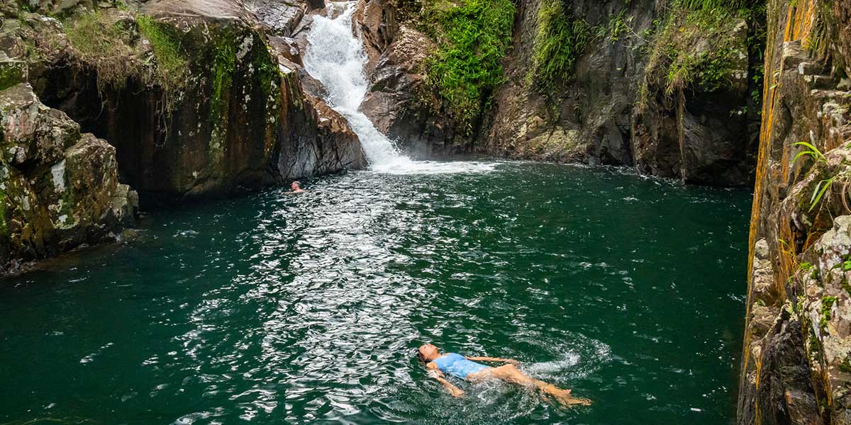 Lush lagoon with waterfalls at the Finch Hatton Gorge in Mackay