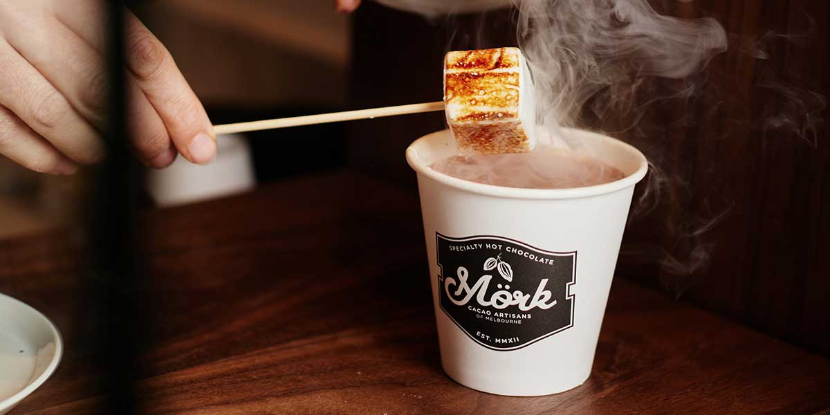 A beaker of hot chocolate with smoked salt and toasted marshmallow at Mörk