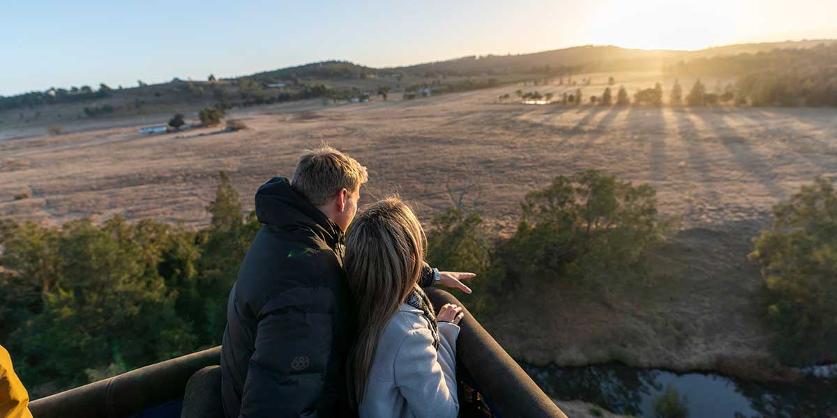 Couple enjoys the scenic view aloft the Hunter Valley Hot Air Balloon