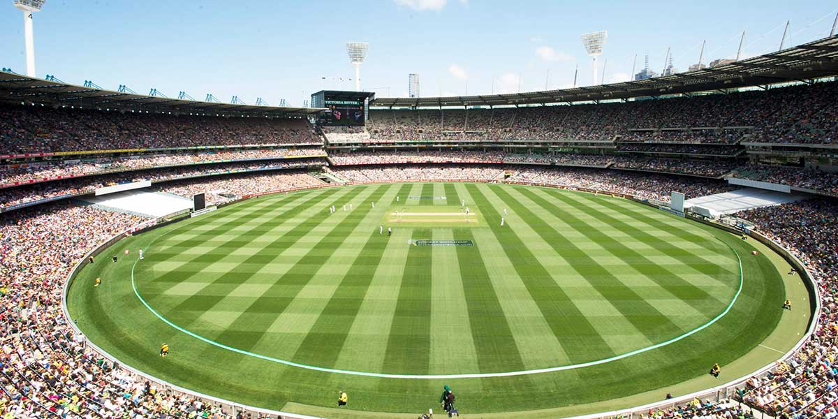 Large playing field inside the Melbourne Cricket Ground with audiences ready to watch the games