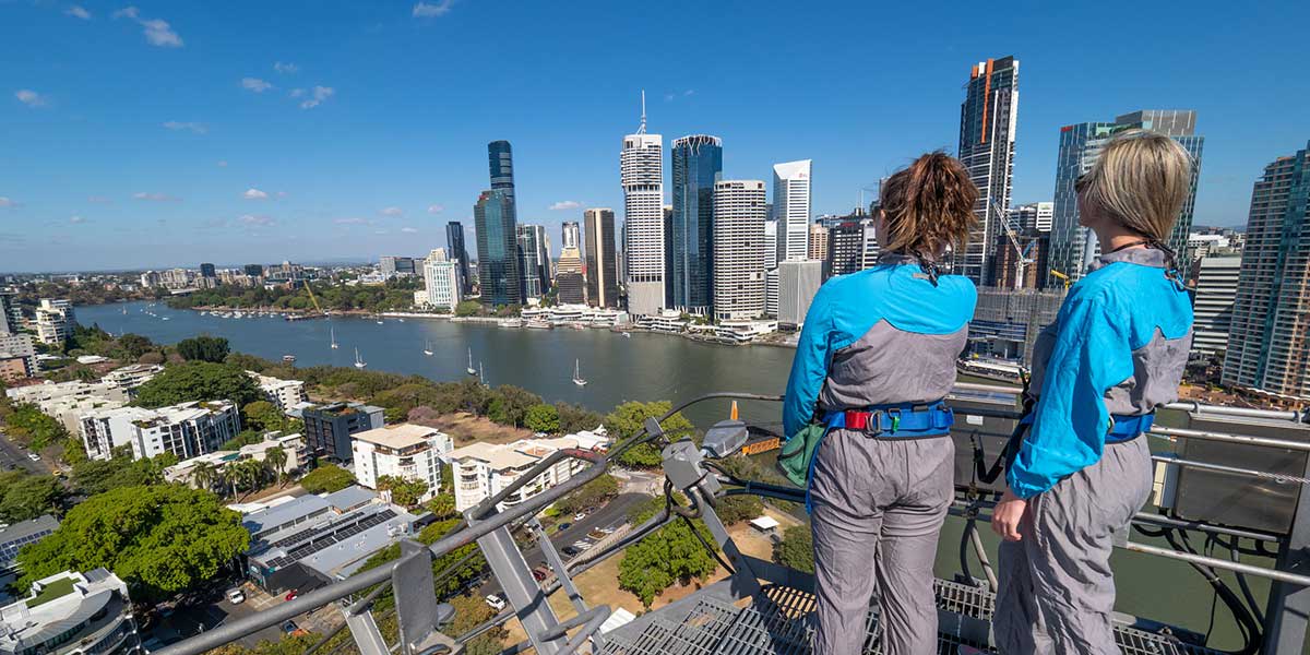 At the Story Bridge Adventure Climb with view over the glistening city of Brisbane