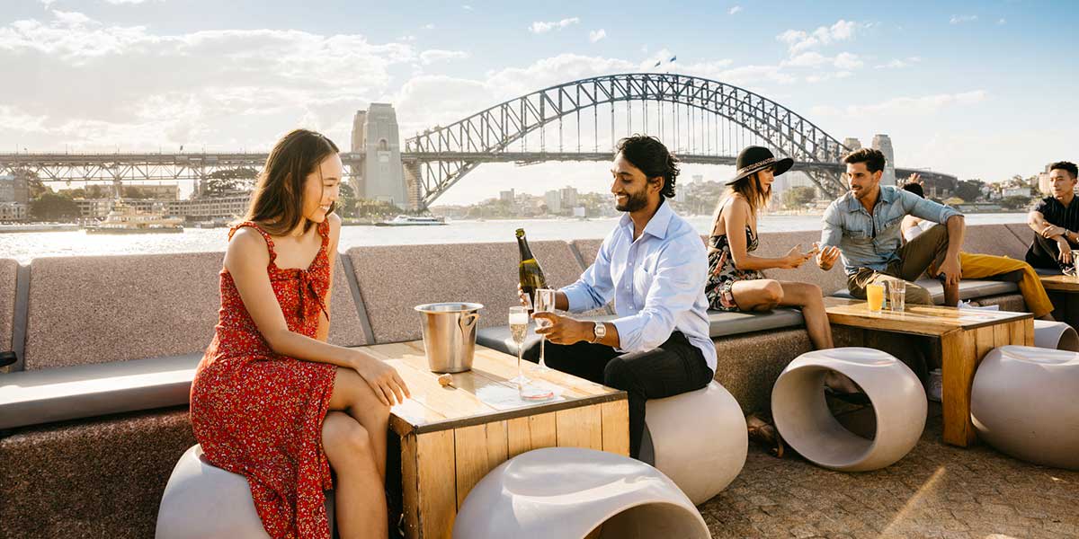 A couple's romantic date with a spectacular view of sunset and a harbour cruise in Opera Bar, Sydney