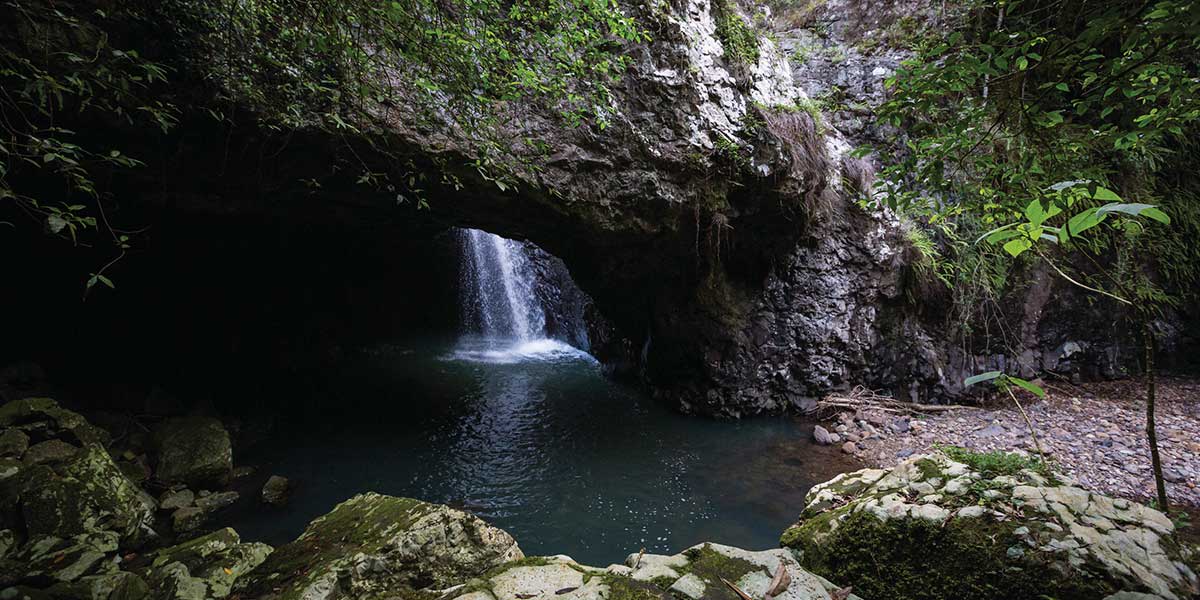 Springbrook National Park's natural rock formation, created by the force of water over the basalt cave