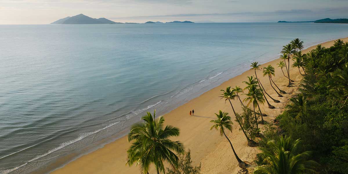 A picture-perfect postcard spot home to pristine golden sands and leaning palm trees of the Mission Beach Queensland