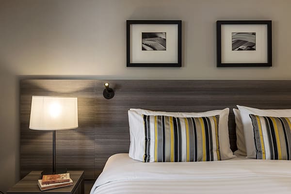 comfortable double bed with clean sheets in 2 bedroom holiday apartment with Wi-Fi and Sky TV at Oaks Shores hotel in Queenstown, New Zealand