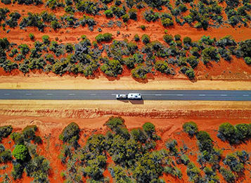 Aerial photograph of truck driving through Australian outback